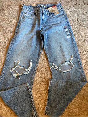 🔥 Levi's Superlow loose Women's Light Blue Distressed Straight leg Jeans size 27